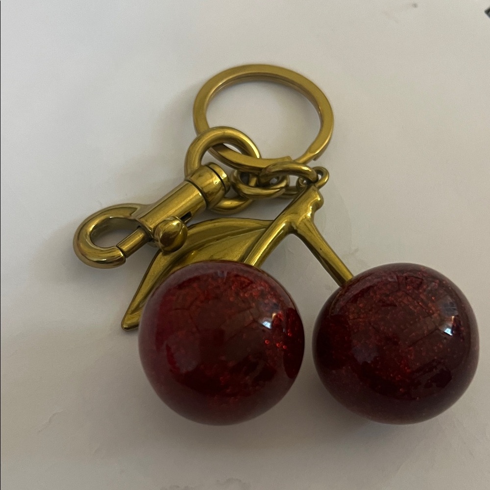 Charming Charlie Red Cherry Keychain with Gold Details